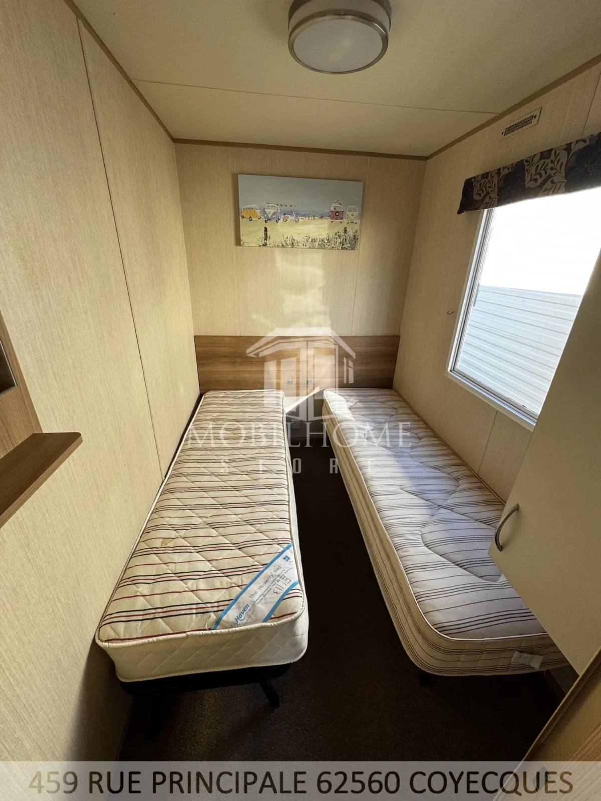 Photo d'une des chambres avec deux lits simples du mobil-home ABI HORIZON