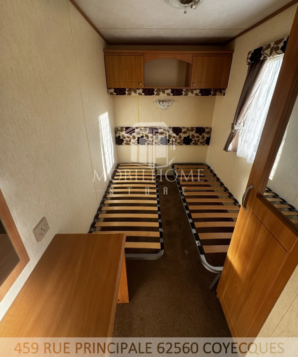 Photo d'une des chambres avec deux lits simples du mobil-home ABI BRISBANE