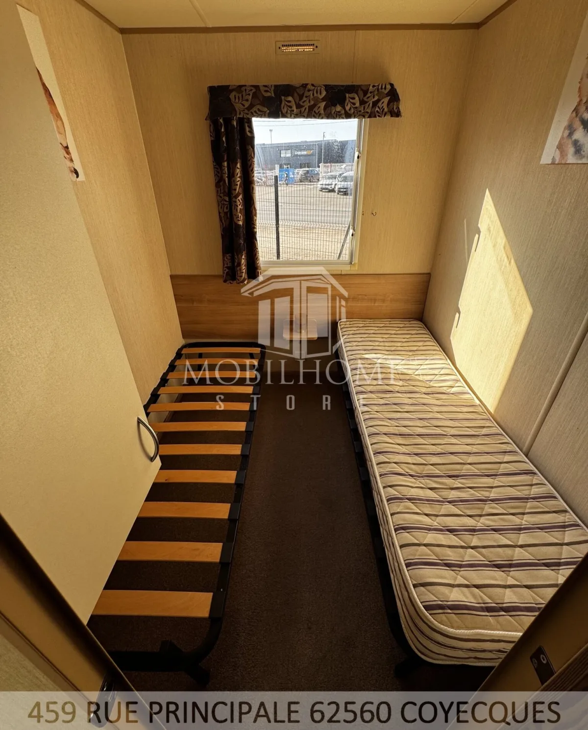 Photo d'une des chambres avec deux lits simples du mobil-home ABI HORIZON